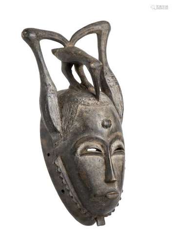 A WOOD MASK Ivory Coast, Yaure  37 cm high  Provenance: