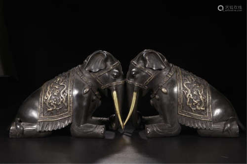 PAIR OF CHINESE PARTLY GILT BRONZE KNEELED ELEPHANT TABLE ITEMS