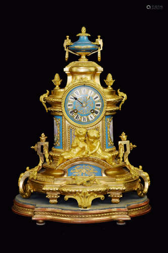 A Gilt Bronze Mental Clock with Two Boys and Porcelain Portrait Surface