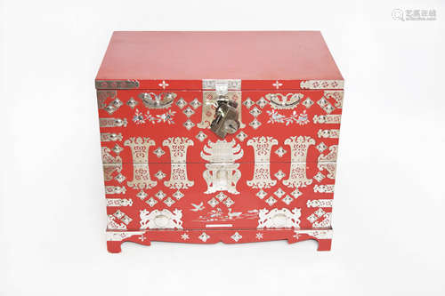 A Korean Cinnabar Lacquered Wood Wardrobe Chest