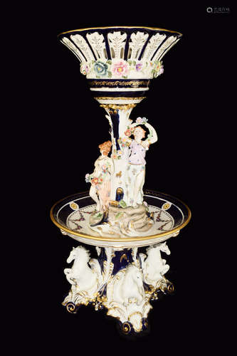 A Large Continental Porcelain Double Layer Fountain Style Vase/Centre Piece with Four Horses and Two Ladies with Flowers