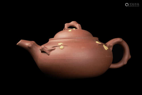 A Chinese Yixing Clay Teapot with Plum Branch Style Decoration, marked as made by 