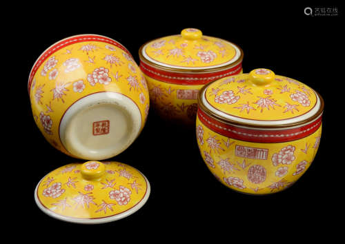 A Set of Three Yellow Glazed Lidded Jars with Plum Blossom and Bamboo