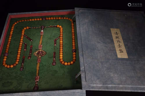 A PLATE OF YELLOW BEADS IN THE BOX