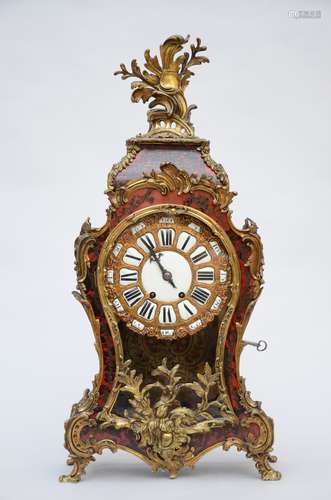 A Louis XV style cartel with Boulle inlaywork