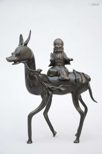 A Chinese bronze statue 'Laotsé on a deer'