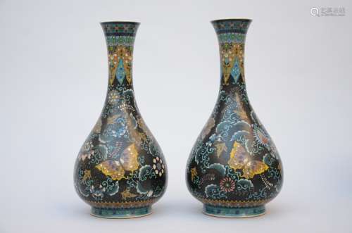 A pair of Japanese porcelain vases with cloisonné decoration