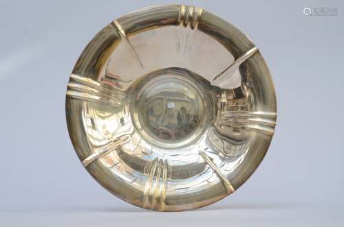 A round dish in silver, marked Wolfers