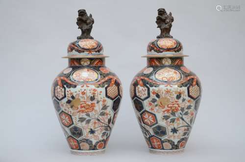 A pair of lidded vases in 'Imari' porcelain