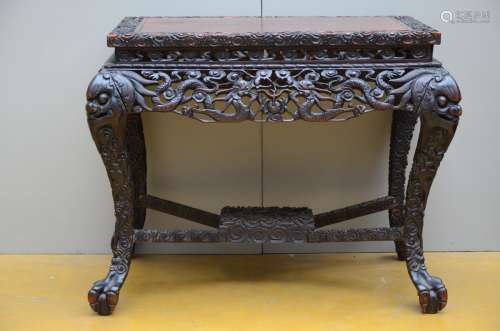 A sculpted Chinese table in hard wood, 19th century
