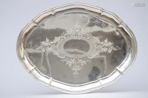 An engraved silver tray
