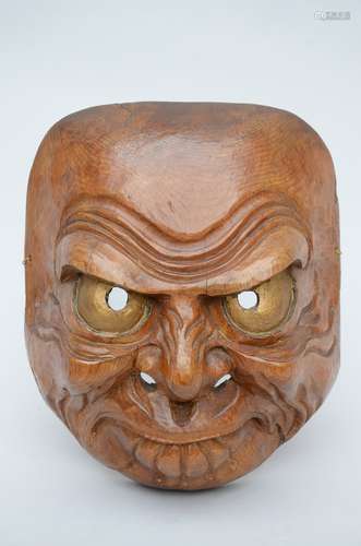 Large Japanese mask in carved wood with gilt eyes