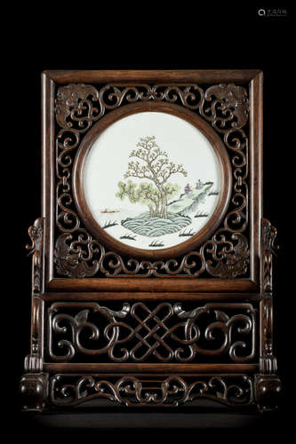 A Chinese hardwood table screen with porcelain plaque