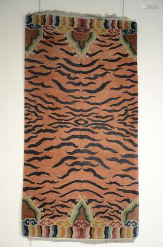 Tibetan tiger rug on orange ground