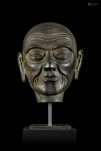 Large head of a lama in copper repoussé, Tibet