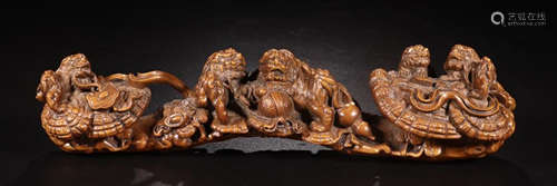 A HUANGYANG WOOD CARVED AUSPICIOUS SHAPED PENDANT