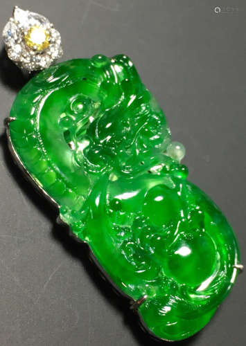 A GREEN JADEITE CARVED DRAGON PENDANT, TYPE A