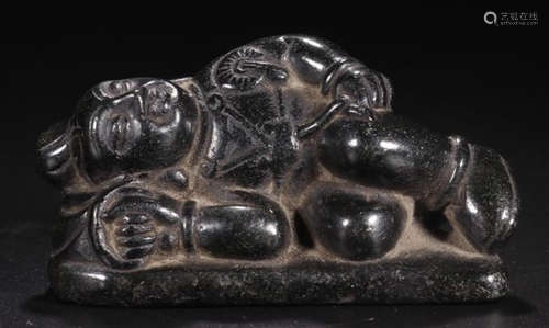 A BLACK STONE CARVED BUDDHA