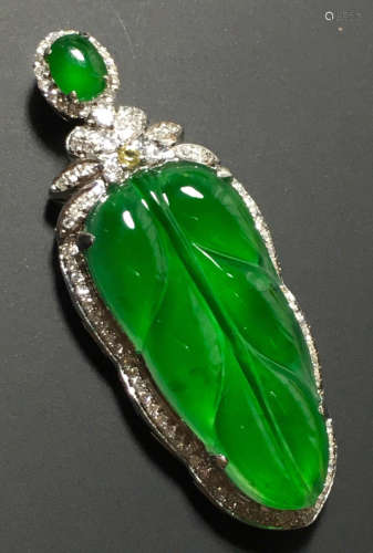 A GREEN JADEITE CARVED LEAF PENDANT, TYPE A