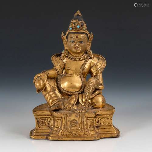 Vergoldeter Buddha.Wohl Tibet, Bronze, vergoldet mit Türkisen, Boden
geschlossen. H 15 cm. Auf einem