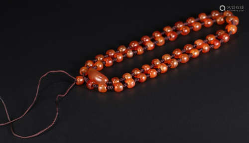 A RED  AGATE BEADS NECKLACE