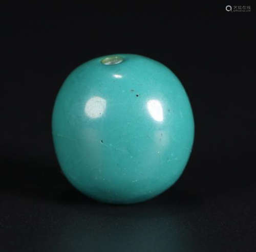 A TURQUOISE STONE BEAD