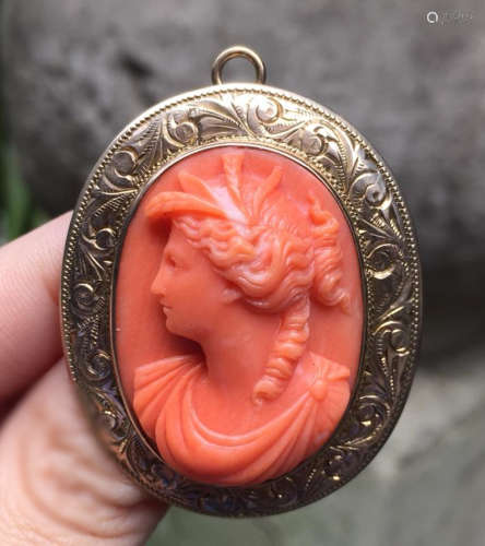 A VICTORIA STYLE LADYS CARVED IN RED CORAL DUAL PURPOSE BROOCH PENDANT