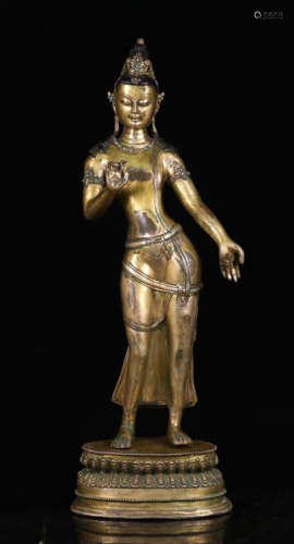 A GILT BRONZE FIGURE OF 