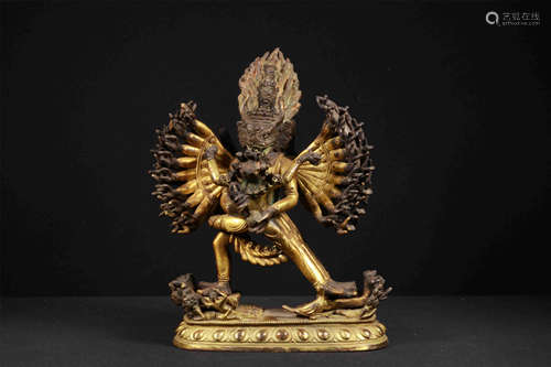 TIBETAN GILT BRONZE SEATED BUDDHIST GUARDIAN