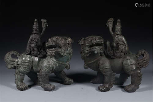 PAIR OF CHINESE BRONZE MEN ON LION INCENSE CAGES