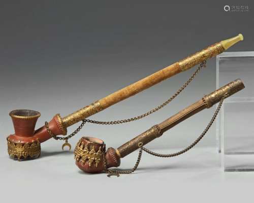 Two gilt ottoman pipes