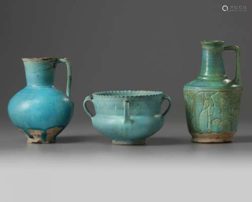 Two Islamic turquoise glazed jugs and a bowl