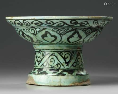 A large Islamic pottery stem bowl