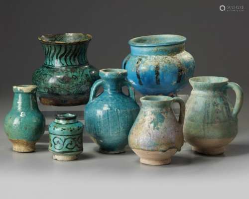 A group of seven Islamic turquoise glazed objects
