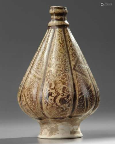 An Islamic Kashan pottery lobed vase