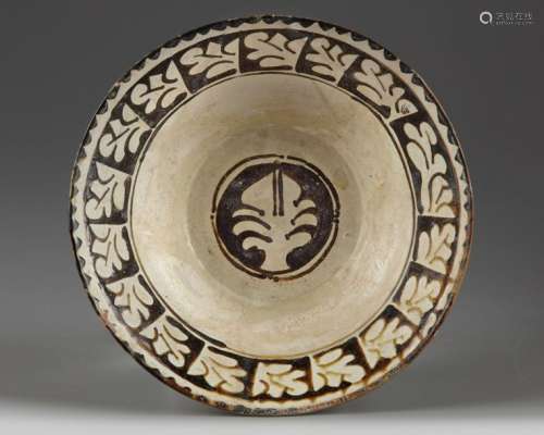 A slip painted islamic pottery bowl