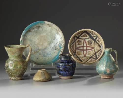 A group of four Islamic jugs and two bowls