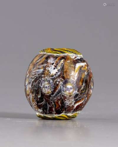 A Roman mosaic glass face bead