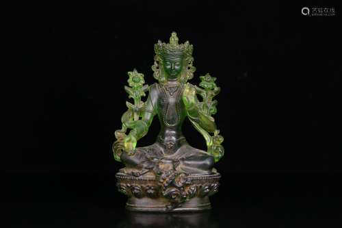 A GREEN GLASS BUDDHA SHAPED ORNAMENT