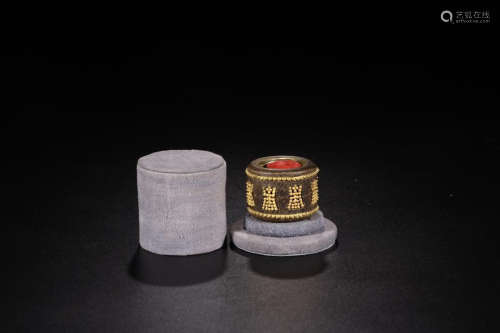 A CHENXIANG WOOD THUMB RING EMBEDED GOLD BEADS