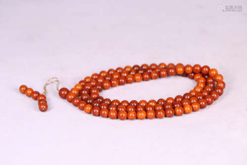 AN AMBER ROSARY OF 108 BEADS