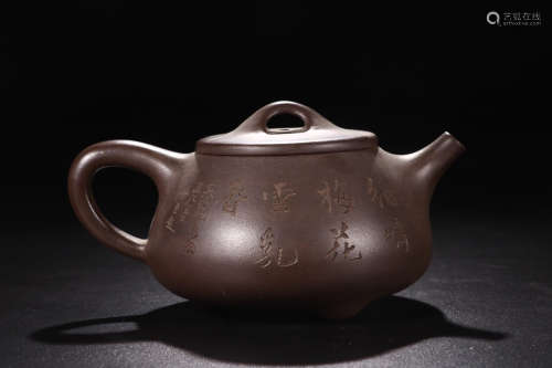 A ZISHA TEAPOT WITH POETRY CARVING