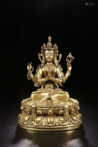 A GILT BRONZE INLAID TURQUOISE AGATE FOUR-ARMED GUANYIN STATUE