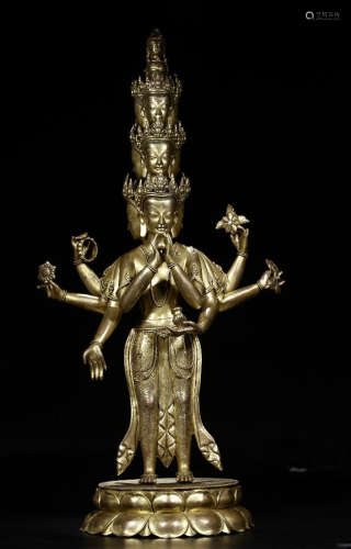 A GILT BRONZE  ELEVEN FACES AND SIX ARM BUDDHA