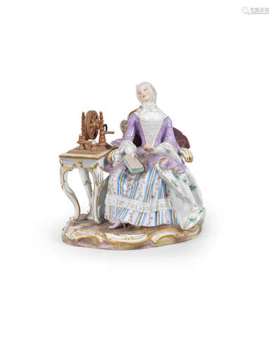 A Meissen group of a lady at a spinning wheel, late 19th century