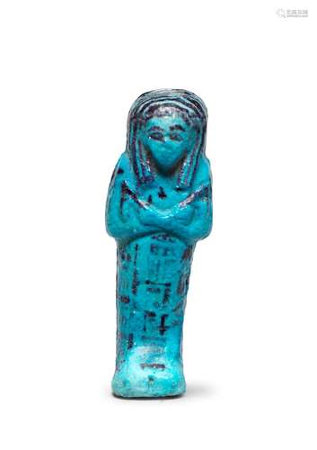 An Egyptian turquoise glazed composition shabti for Amenemipt