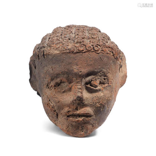 A Romano-Egyptian terracotta head of a youth