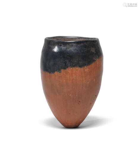 An Egyptian black-topped pottery jar