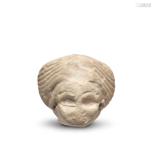 A Sumerian indurated limestone head of a female worshipper