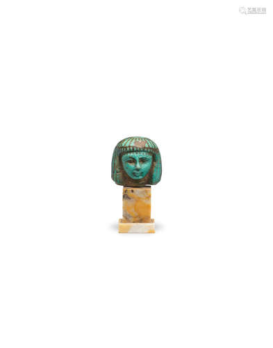 An Egyptian glazed composition female head